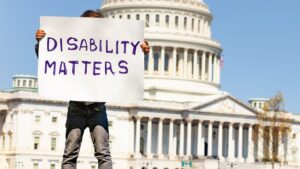 The U.S. Capitol with a sign that says Disability Matters.